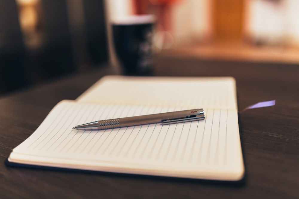 coffee notebook pen writing